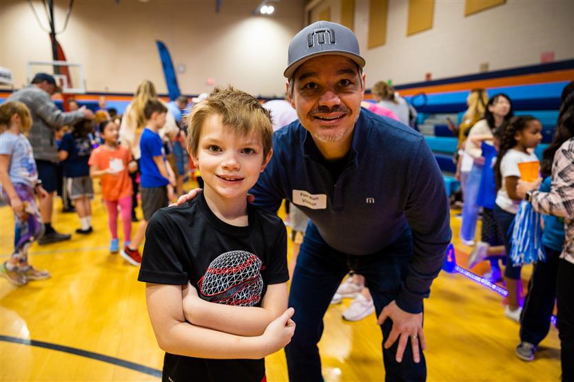 Students and families participate in a fun run